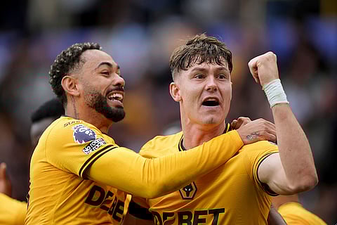 Premier League 2024-25: Wolverhampton Wanderers' Jorgen Strand Larsen, right, celebrates scoring with teammate Matheus Cunha against Chelsea
